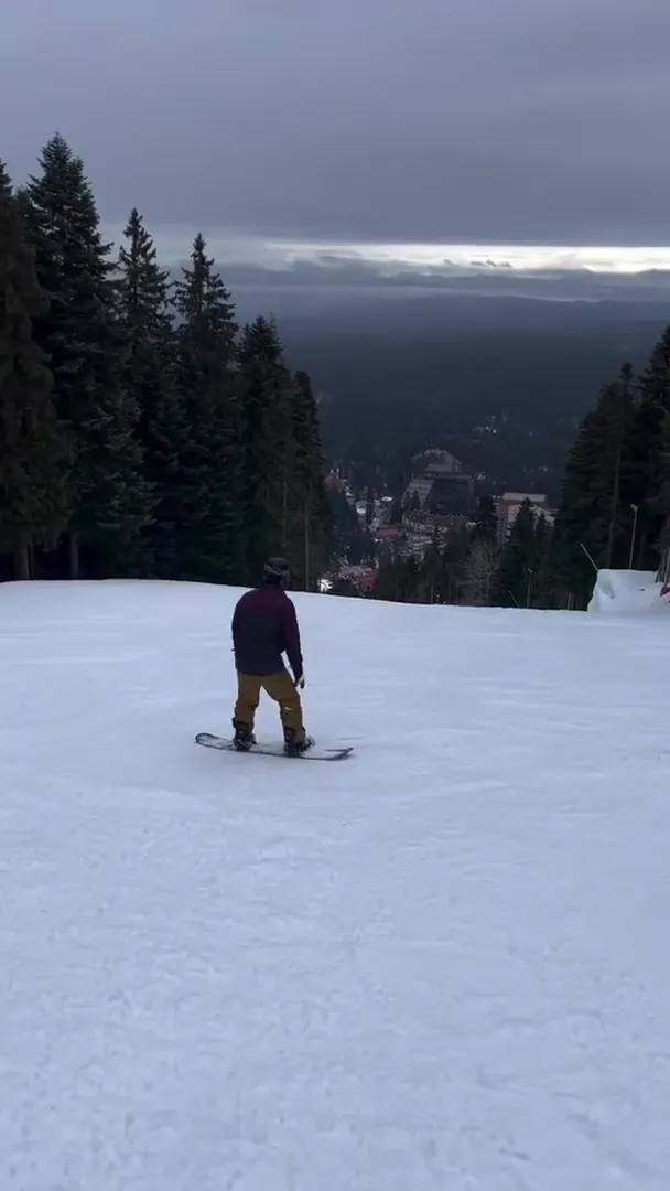 Snowboarder practicing his newly learned skills on Iglika slope