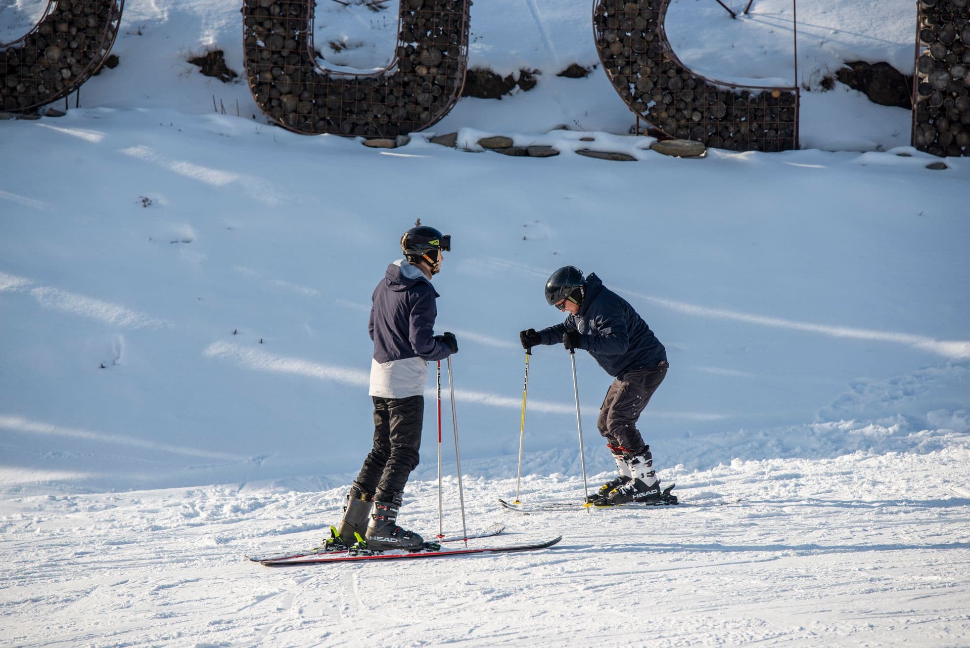 Ski instructor coaching a beginner on a slope in Borovets, Bulgaria