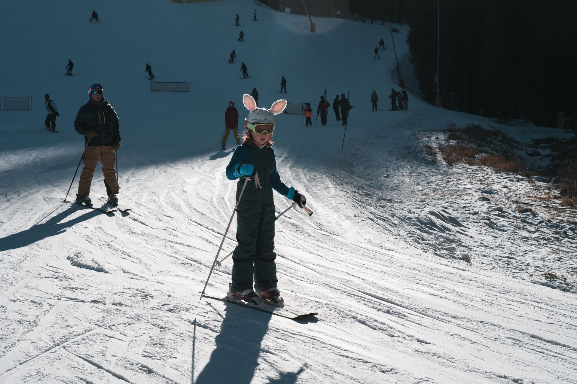 Child learning to ski on a slope in Borovets, Bulgaria